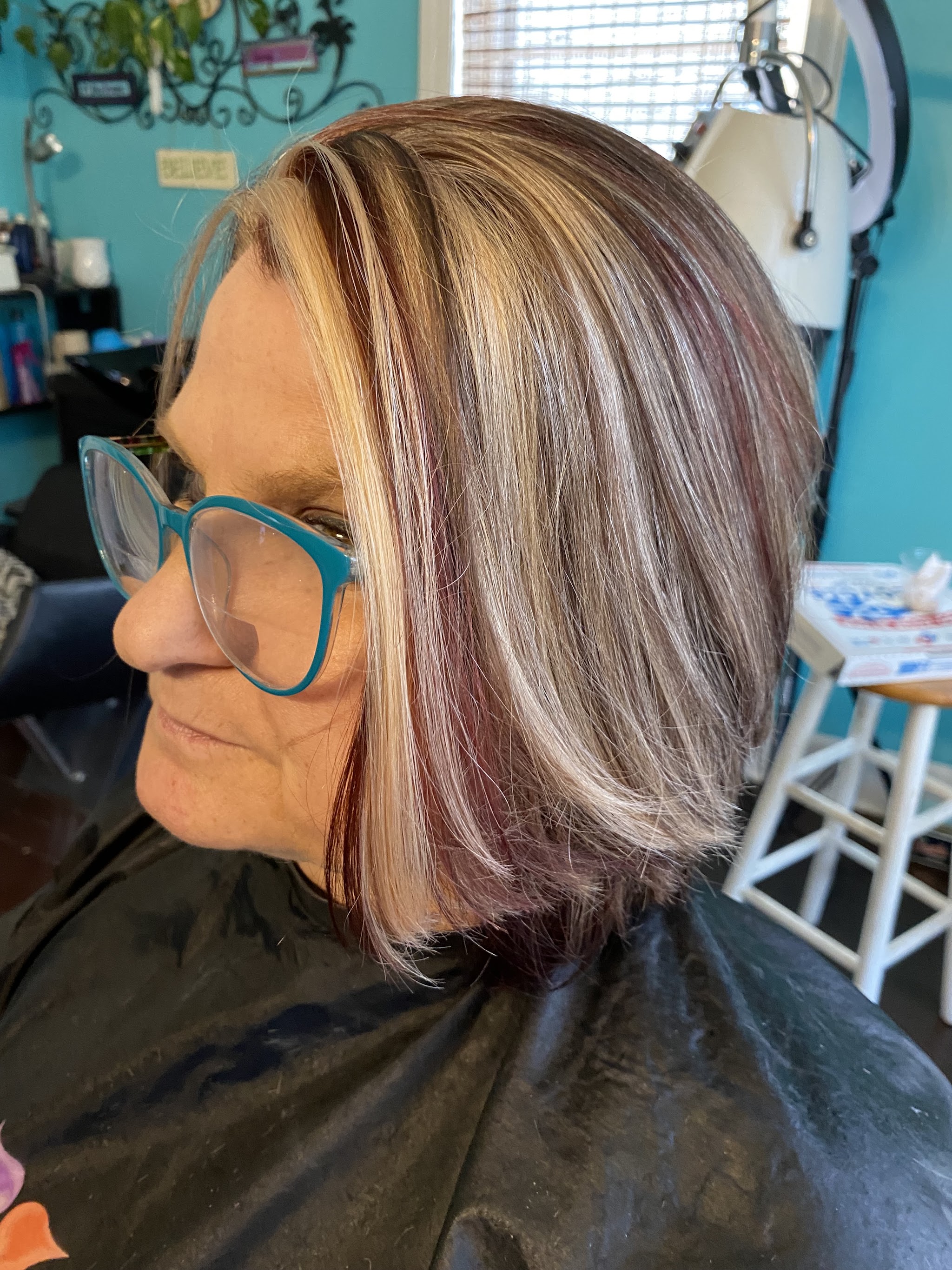 Layered bob with caramel and plum highlights